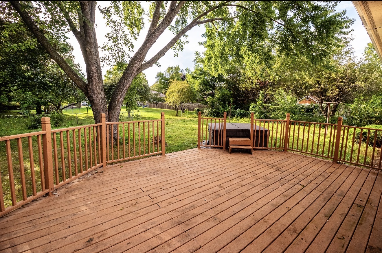 911 Colonade Road Shorewood, IL 60404 - Photo 6 of 36 a deck view with a wooden floor next to a yard