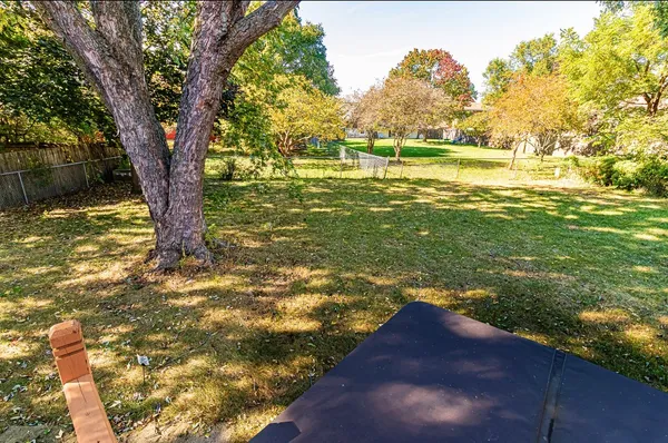 a view of a yard with an outdoor space