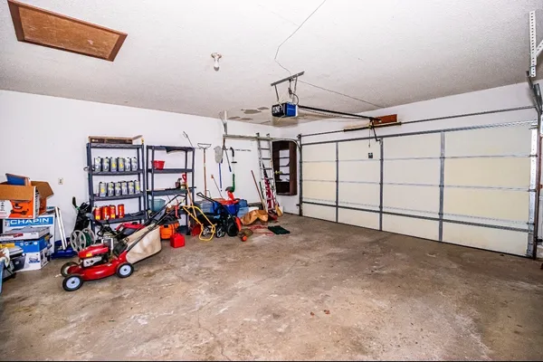 a view of a garage with rack and bicycle
