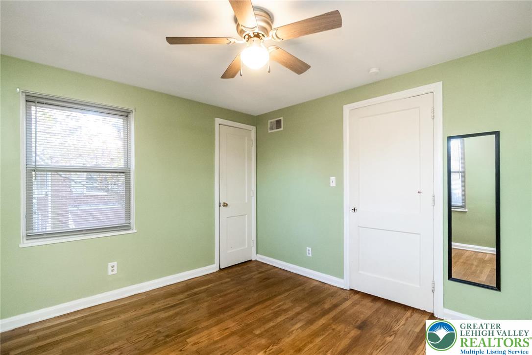 240 Palmer Street Easton, PA 18042 - Photo 22 of 37 a view of an empty room with window and wooden floor