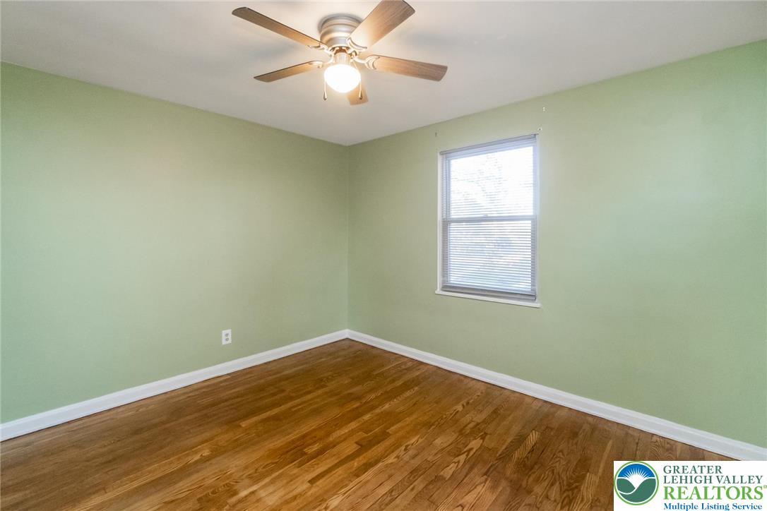 240 Palmer Street Easton, PA 18042 - Photo 24 of 37 an empty room with a window and ceiling fan