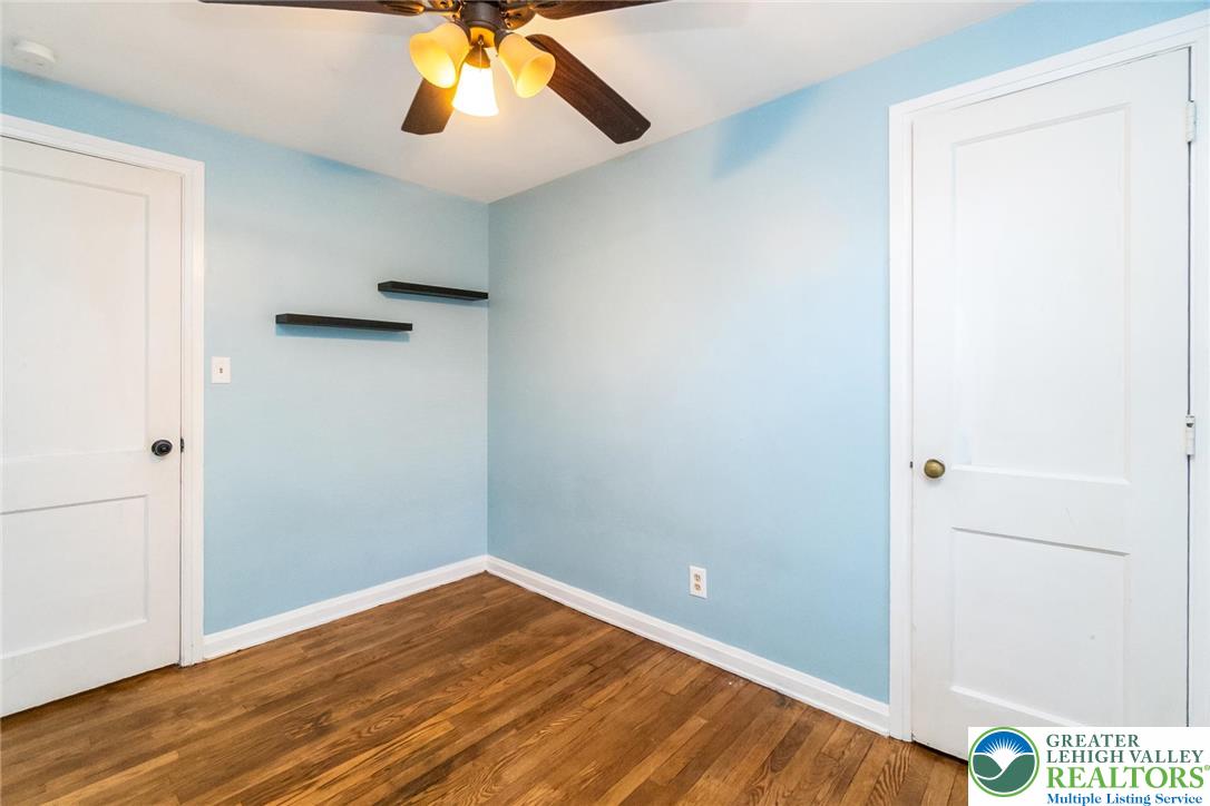 240 Palmer Street Easton, PA 18042 - Photo 28 of 37 a view of an empty room with wooden floor and a window