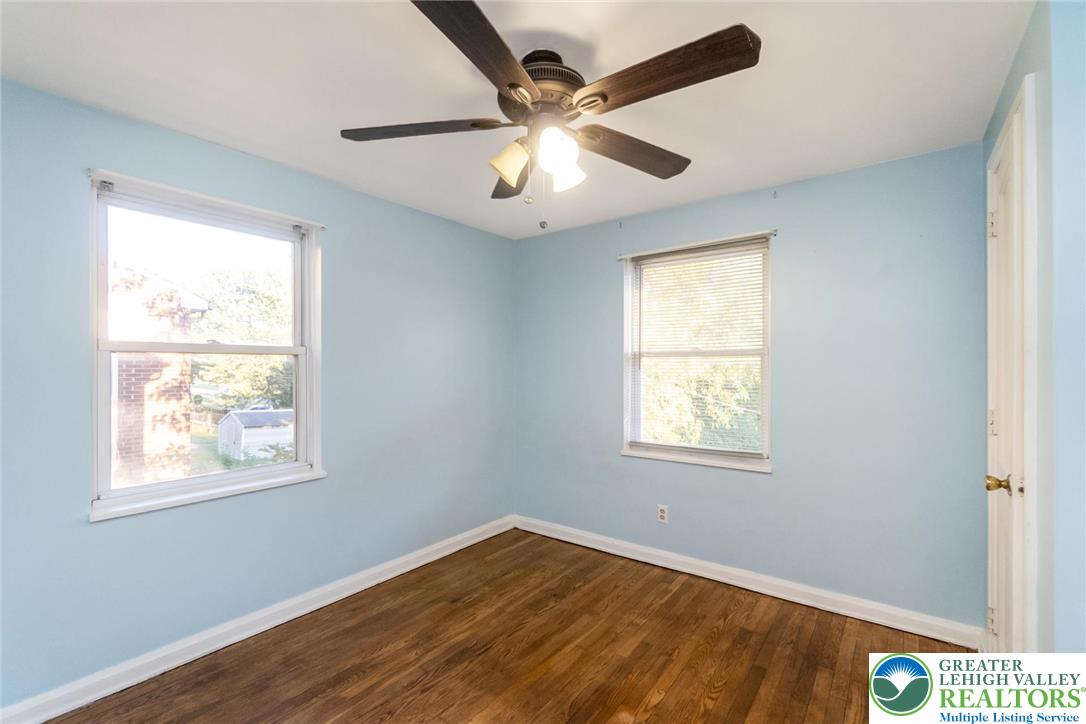 240 Palmer Street Easton, PA 18042 - Photo 30 of 37 a view of an empty room with wooden floor and a window