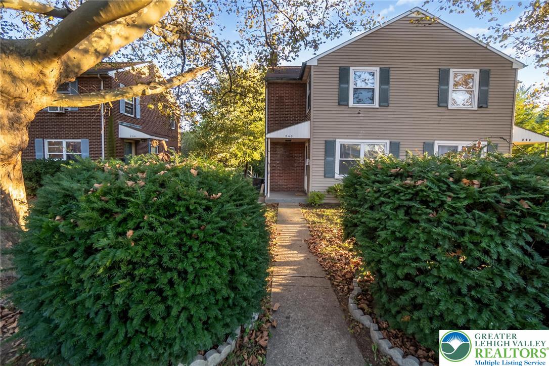 240 Palmer Street Easton, PA 18042 - Photo 3 of 37 a front view of a house with a yard and trees