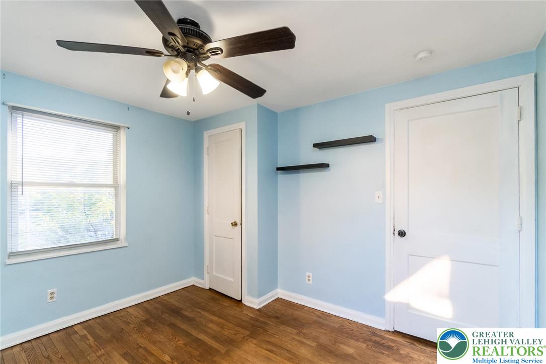 240 Palmer Street Easton, PA 18042 - Photo 31 of 37 a view of an empty room with wooden floor and a window