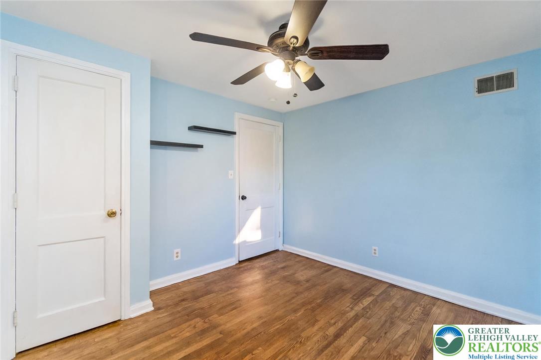 240 Palmer Street Easton, PA 18042 - Photo 32 of 37 an empty room with wooden floor and windows