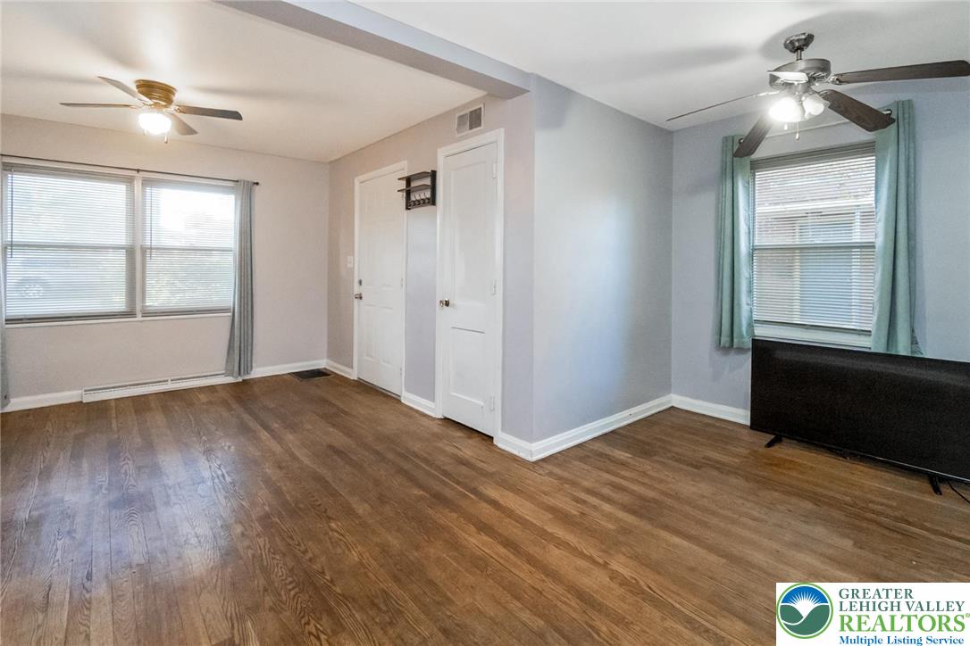 240 Palmer Street Easton, PA 18042 - Photo 10 of 37 a view of an empty room with wooden floor and a window