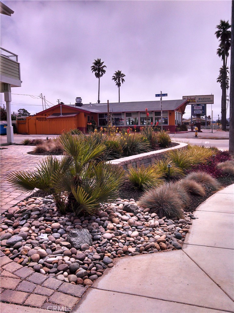 2500 Main Street Morro Bay, CA 93442 - Photo 9 of 9 a view of a swimming pool with a house and a yard