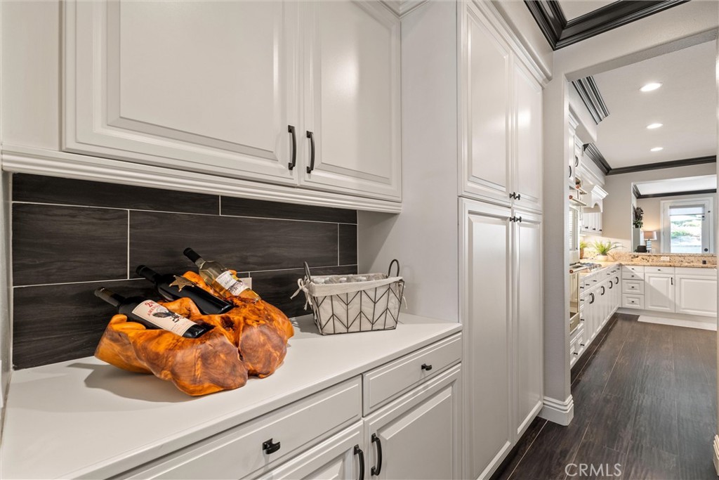 2440 Highwood Road Orange, CA 92867 - Photo 15 of 53 a kitchen with stainless steel appliances a cabinets and a wooden floor