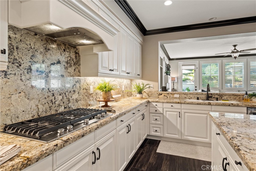 2440 Highwood Road Orange, CA 92867 - Photo 20 of 53 a large white kitchen with sink and stove
