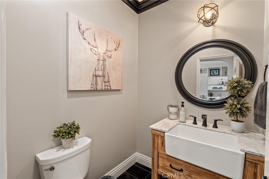 2440 Highwood Road Orange, CA 92867 - Photo 24 of 53 a bathroom with a sink mirror and toilet