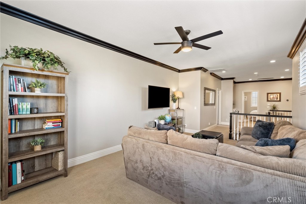 2440 Highwood Road Orange, CA 92867 - Photo 27 of 53 a living room with furniture and a flat screen tv