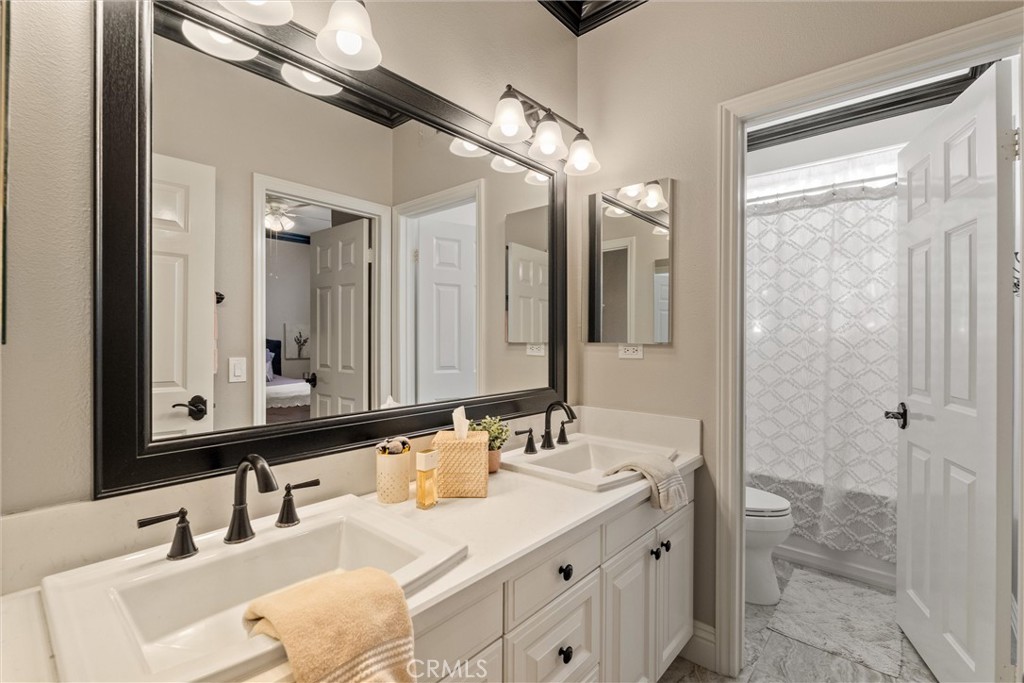 2440 Highwood Road Orange, CA 92867 - Photo 32 of 53 a bathroom with a double vanity sink mirror and double