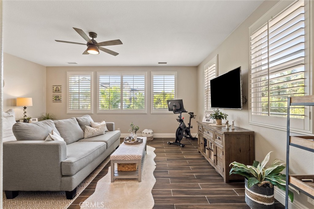 2440 Highwood Road Orange, CA 92867 - Photo 37 of 53 a living room with furniture and a flat screen tv