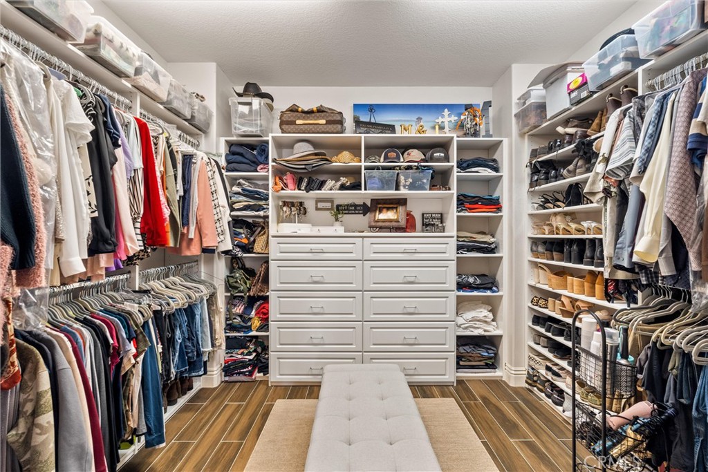 2440 Highwood Road Orange, CA 92867 - Photo 42 of 53 a view of walk in closet with clothes and shoes