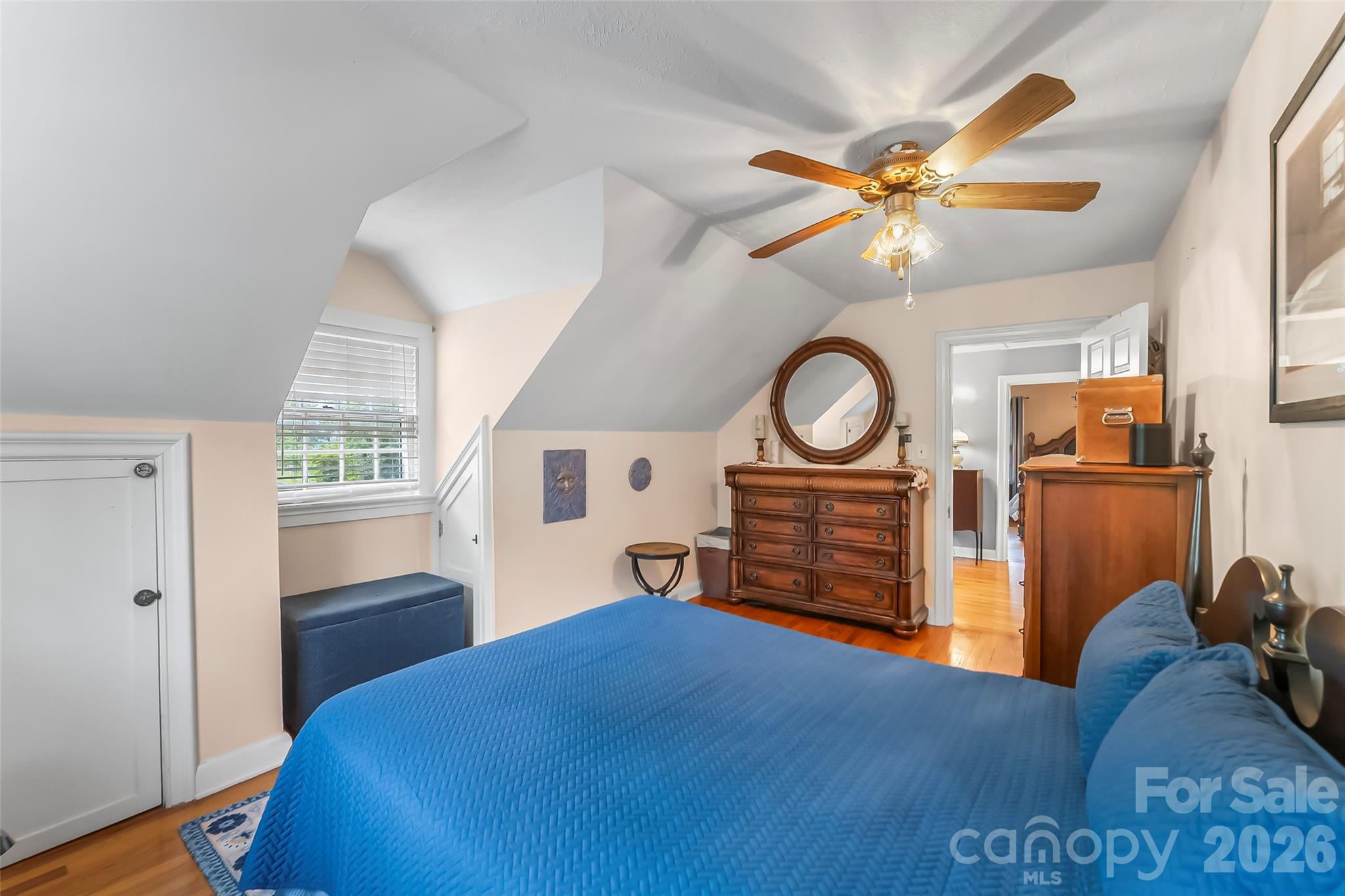 9 Crescent Drive Marion, NC 28752 - Photo 19 of 35 a bedroom with a bed and a chandelier
