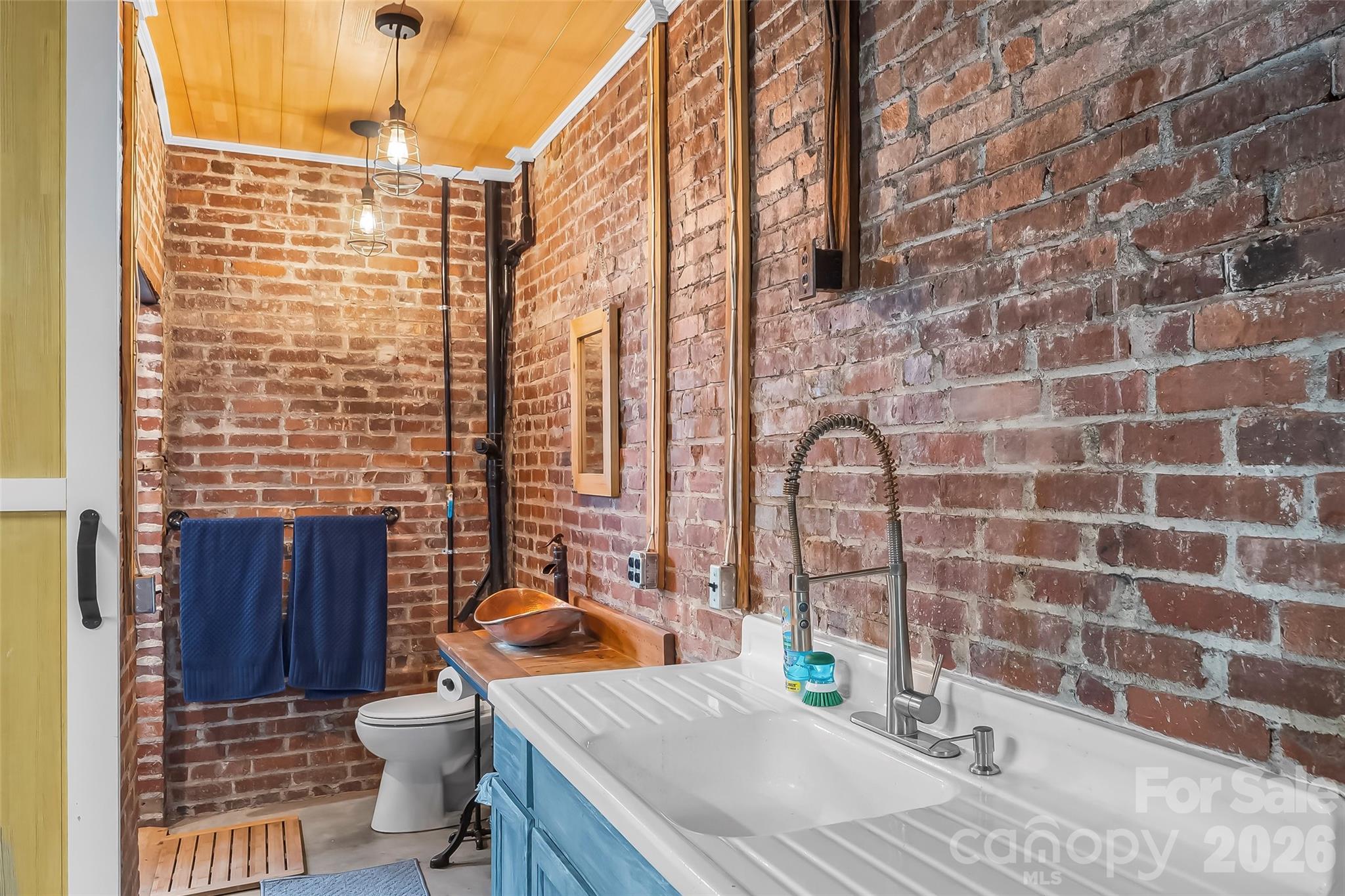 9 Crescent Drive Marion, NC 28752 - Photo 24 of 35 a bathroom with a sink a toilet and shower