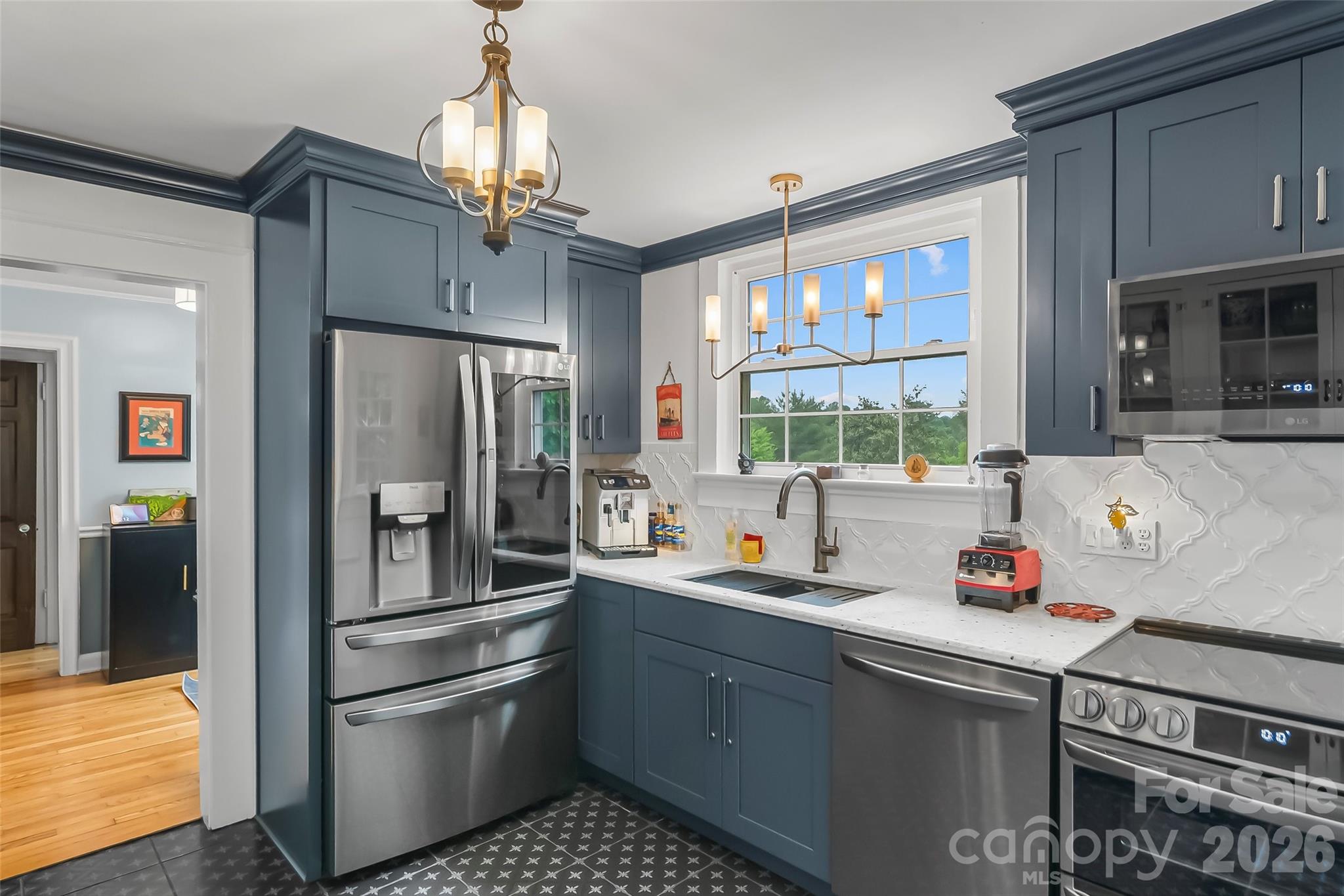 9 Crescent Drive Marion, NC 28752 - Photo 9 of 35 a kitchen with stainless steel appliances a sink stove and refrigerator