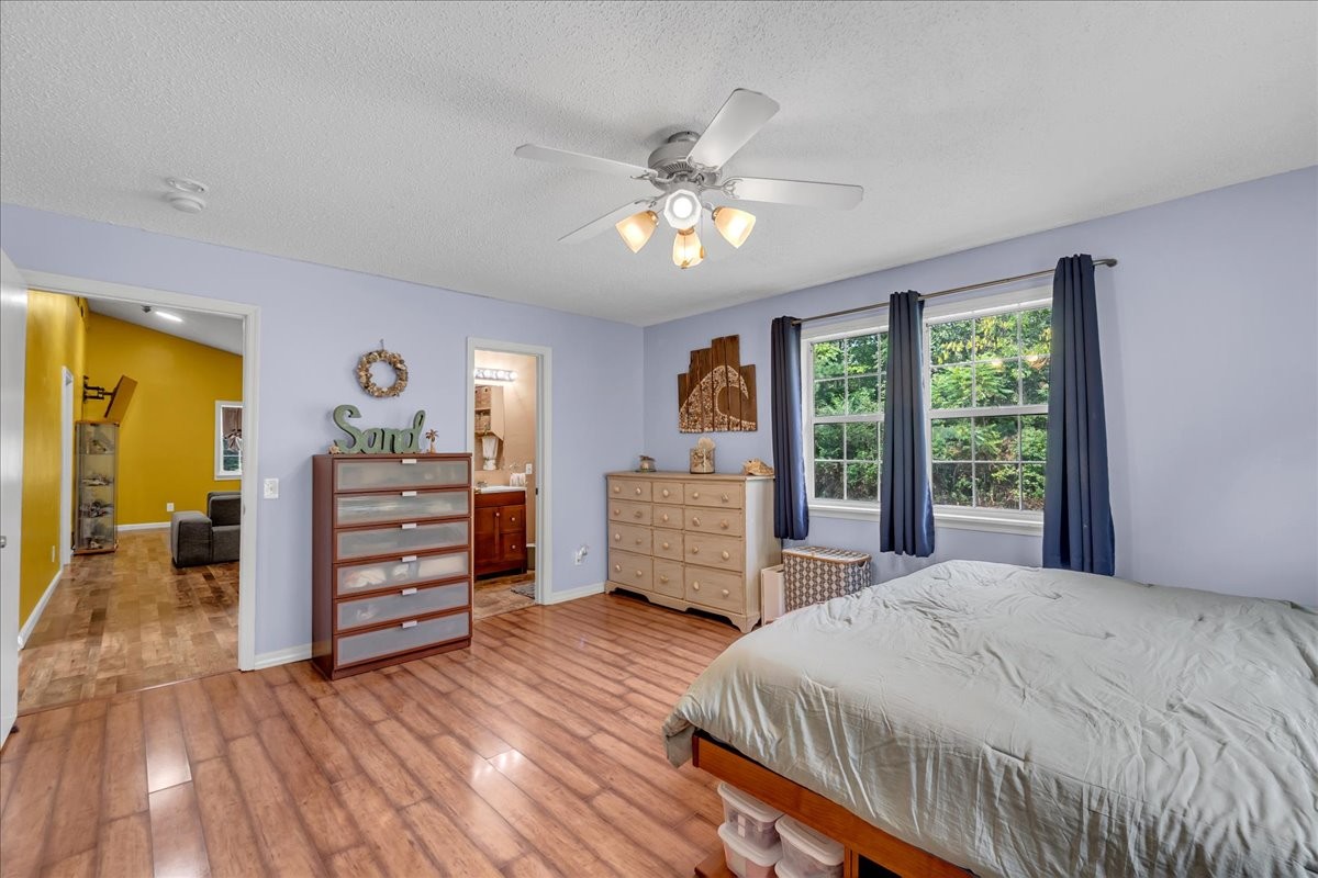 413 Walden Ridge Road Manchester, TN 37355 - Photo 23 of 71 a bedroom with a bed and wooden floor
