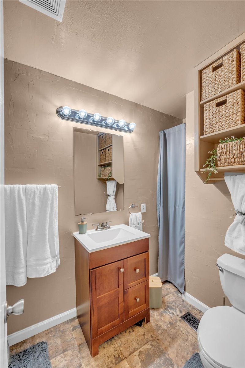 413 Walden Ridge Road Manchester, TN 37355 - Photo 24 of 71 a bathroom with a sink a toilet and mirror