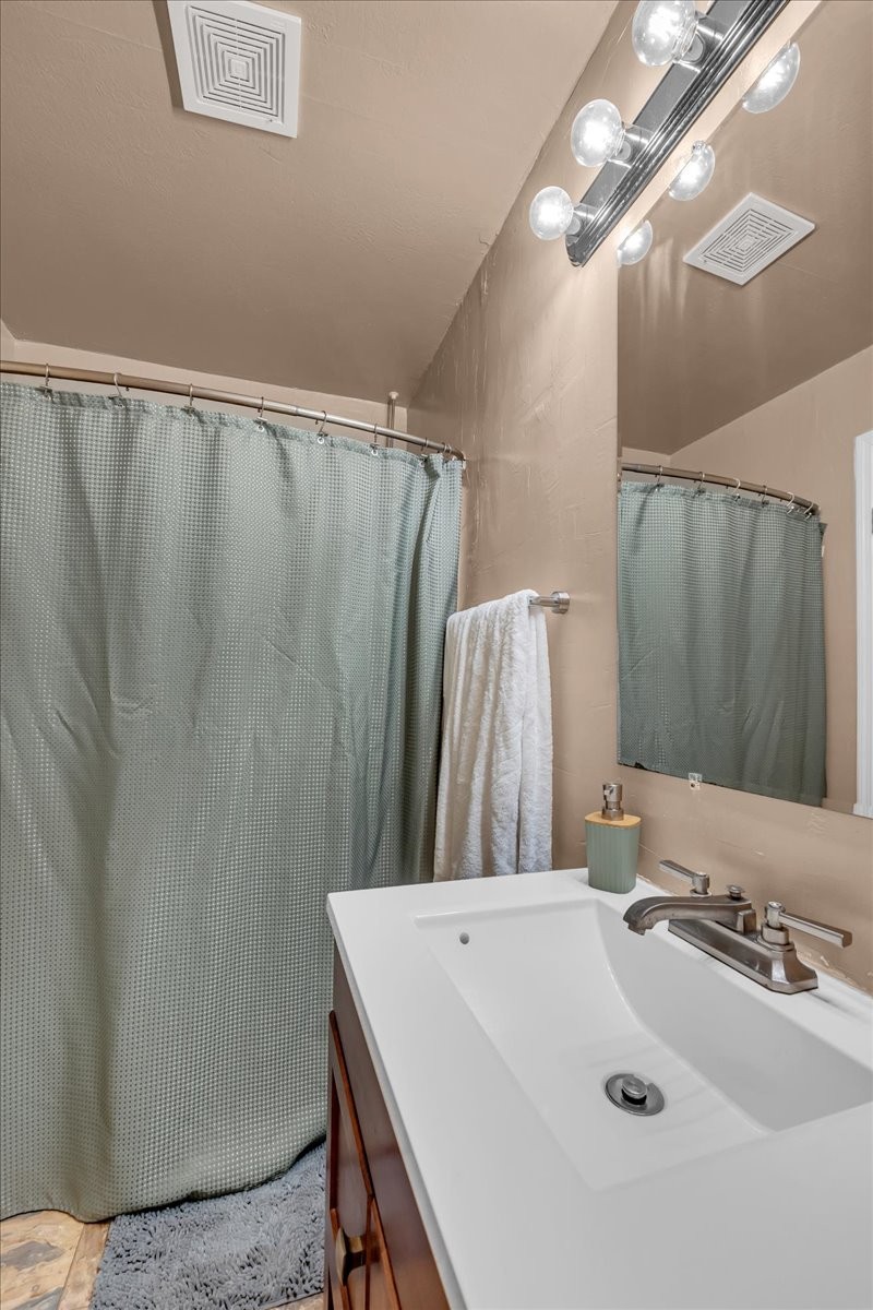 413 Walden Ridge Road Manchester, TN 37355 - Photo 25 of 71 a bathroom with a sink a mirror and a shower