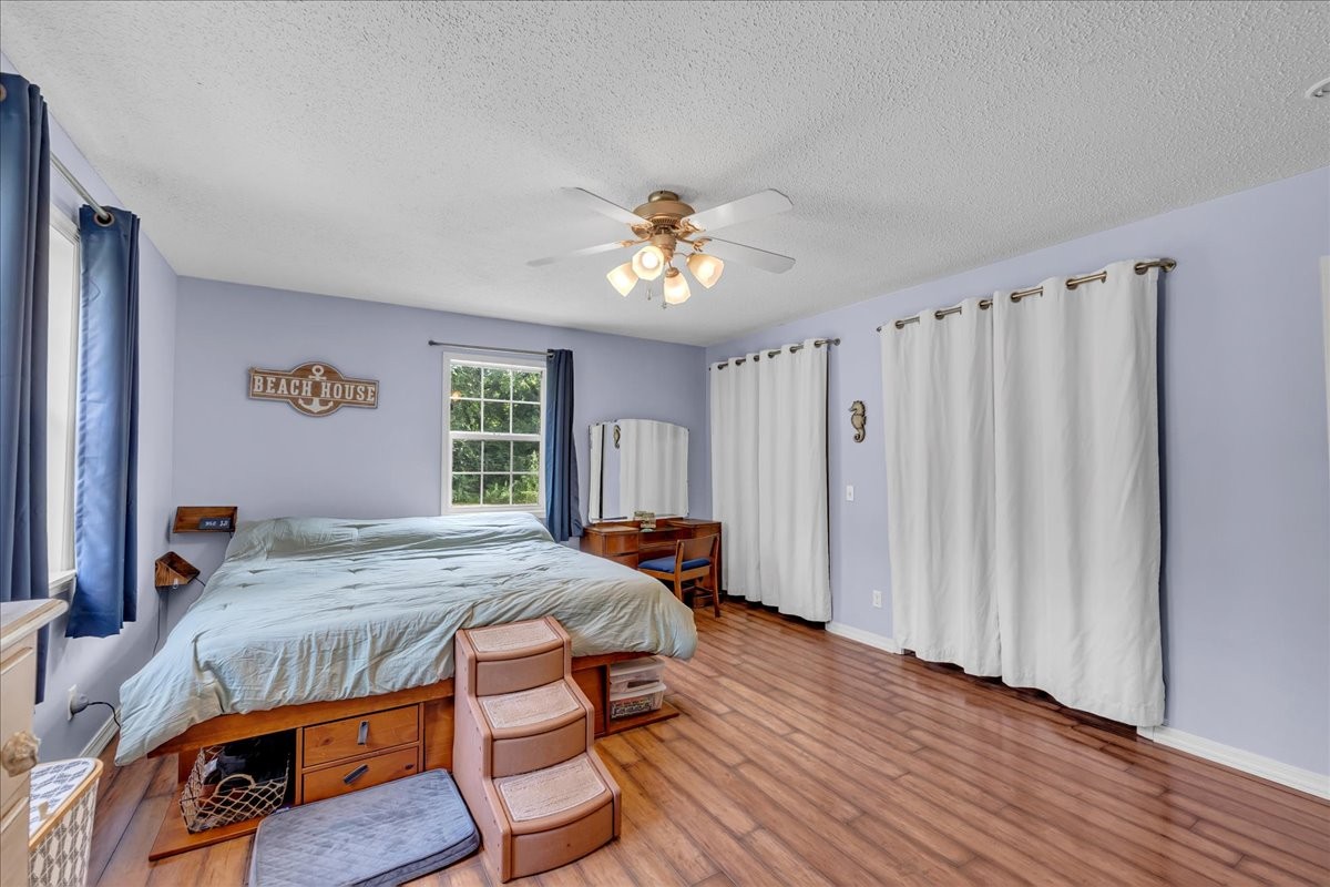 413 Walden Ridge Road Manchester, TN 37355 - Photo 26 of 71 a bed sitting in a spacious bedroom next to a window