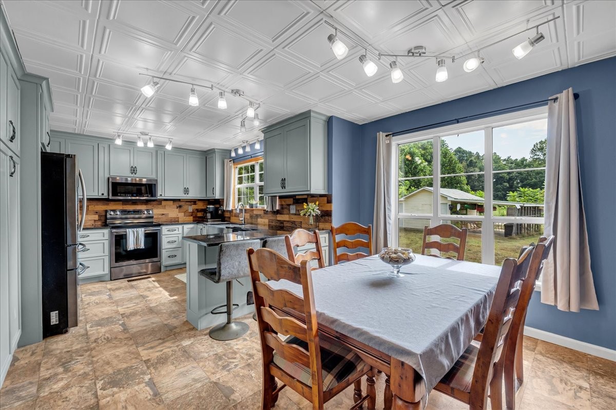 413 Walden Ridge Road Manchester, TN 37355 - Photo 28 of 71 a view of a dining area with furniture window and outside view