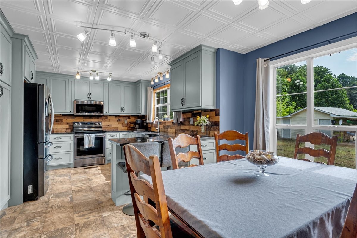 413 Walden Ridge Road Manchester, TN 37355 - Photo 29 of 71 a kitchen with kitchen island a large counter top space appliances and cabinets