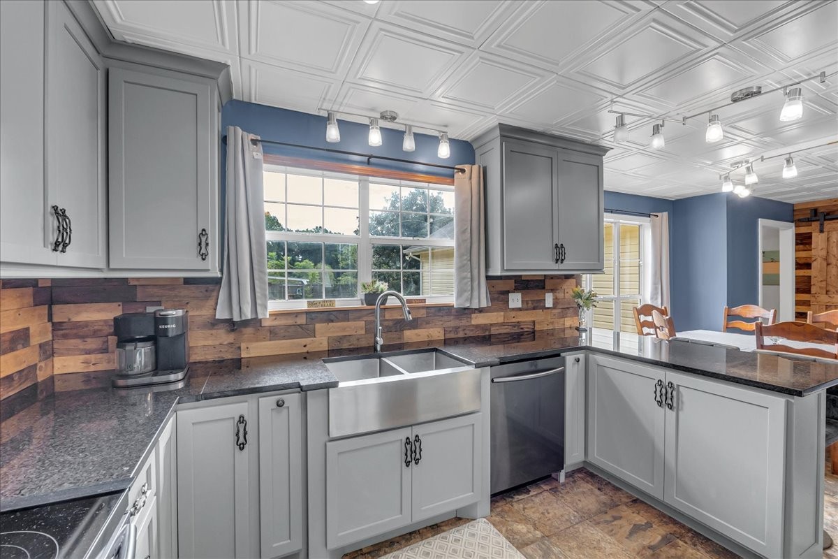 413 Walden Ridge Road Manchester, TN 37355 - Photo 35 of 71 a kitchen with a sink stove and cabinets