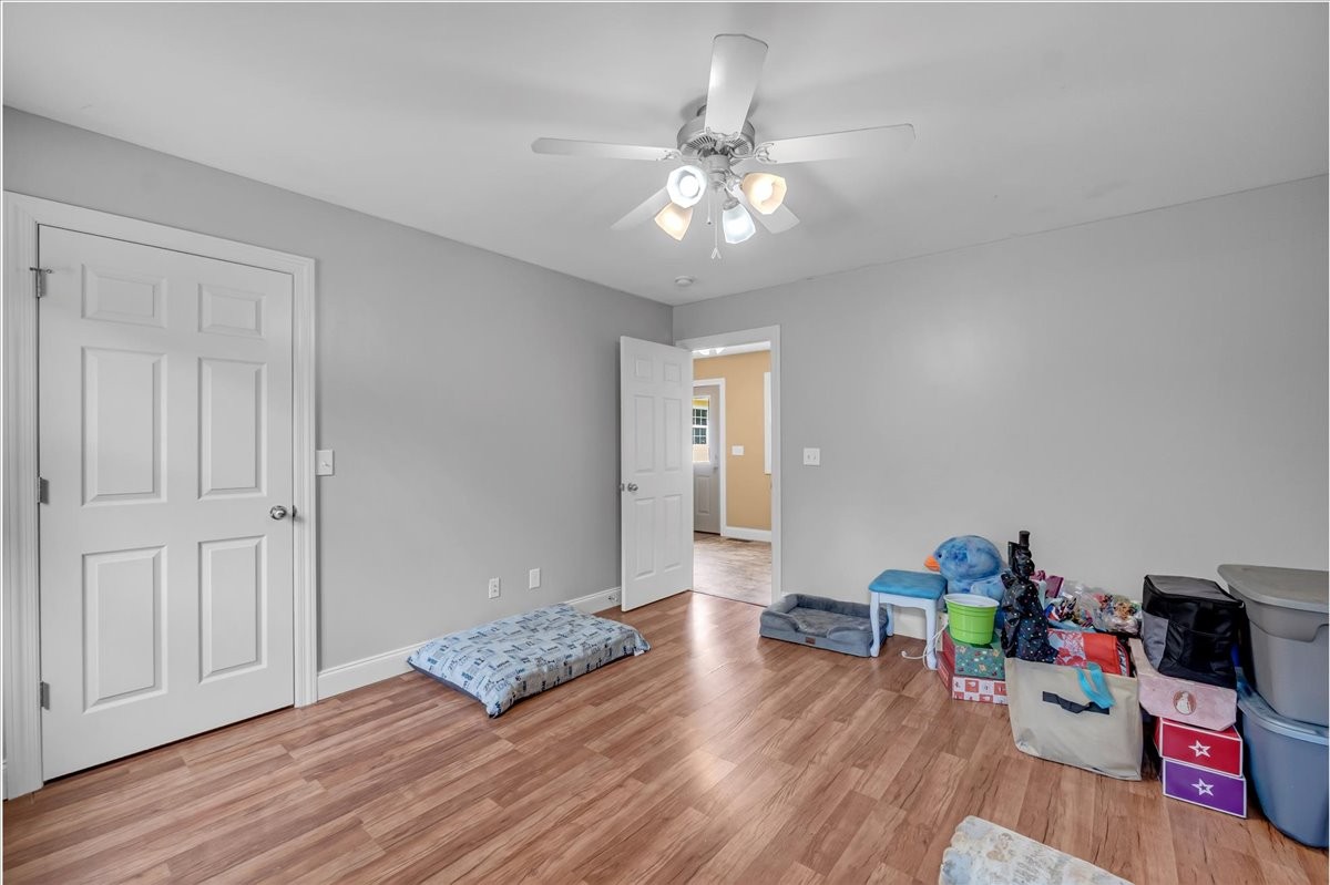 413 Walden Ridge Road Manchester, TN 37355 - Photo 50 of 71 a living room with furniture and a wooden floor