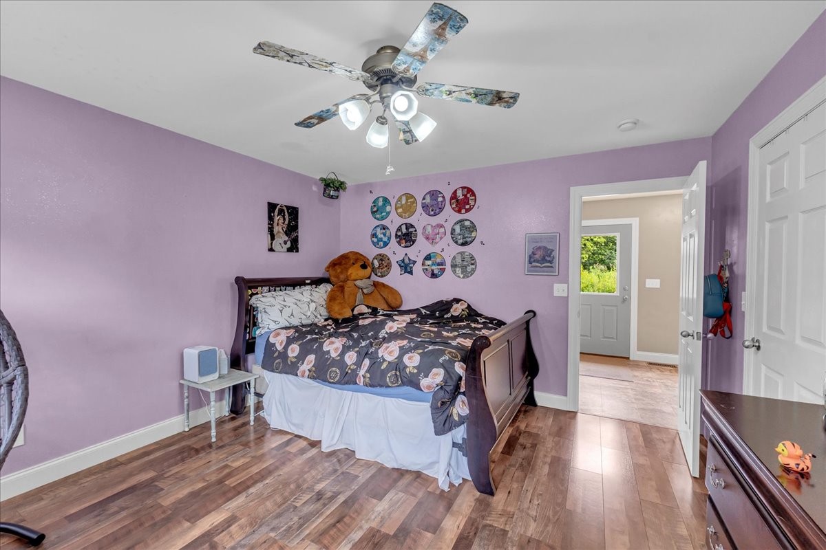 413 Walden Ridge Road Manchester, TN 37355 - Photo 53 of 71 a bed room with a bed and a chandelier
