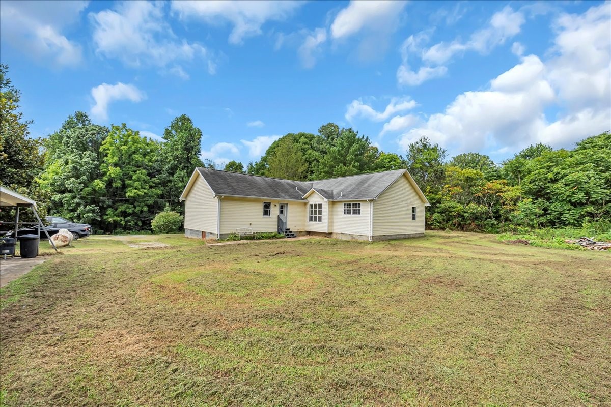 413 Walden Ridge Road Manchester, TN 37355 - Photo 57 of 71 a front view of house with yard and trees in the background