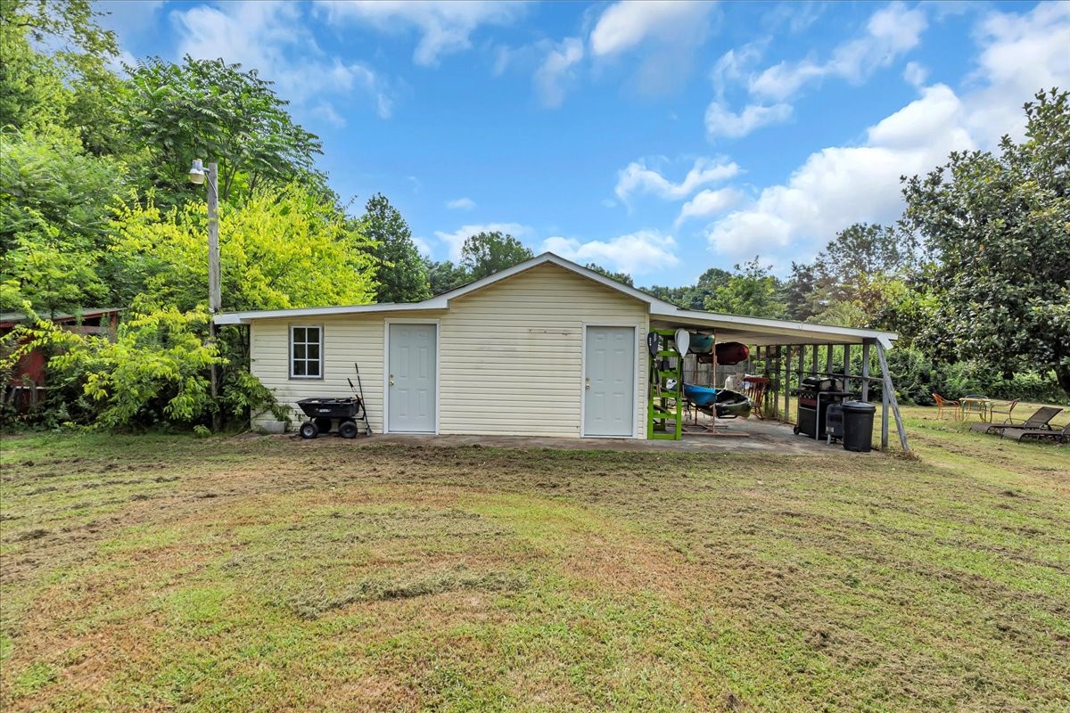 413 Walden Ridge Road Manchester, TN 37355 - Photo 60 of 71 a view of a house with backyard and sitting area