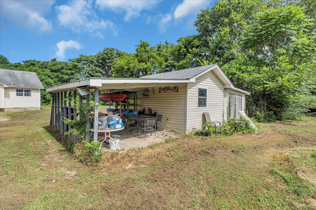 413 Walden Ridge Road Manchester, TN 37355 - Photo 65 of 71 a view of a small house in the back yard