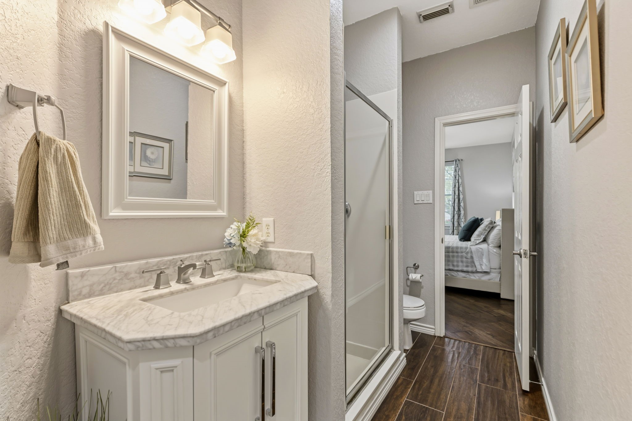 20102 Windbury Court Spring, TX 77379 - Photo 11 of 49 a en suite bathroom with a sink a mirror and a shower
