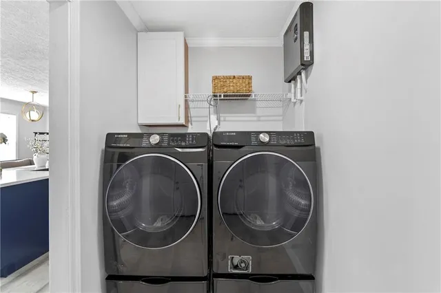 a utility room with dryer and washer