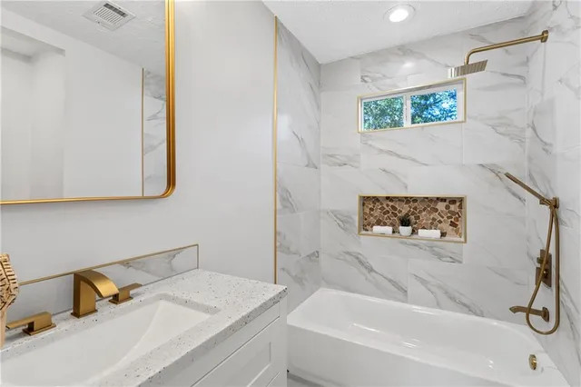 a bathroom with a sink and a bathtub