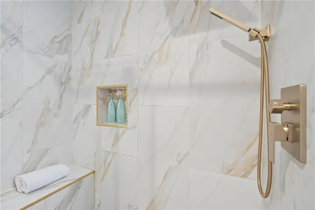 a bathroom with a shower and toilet