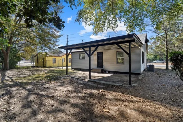 a house view with a backyard space