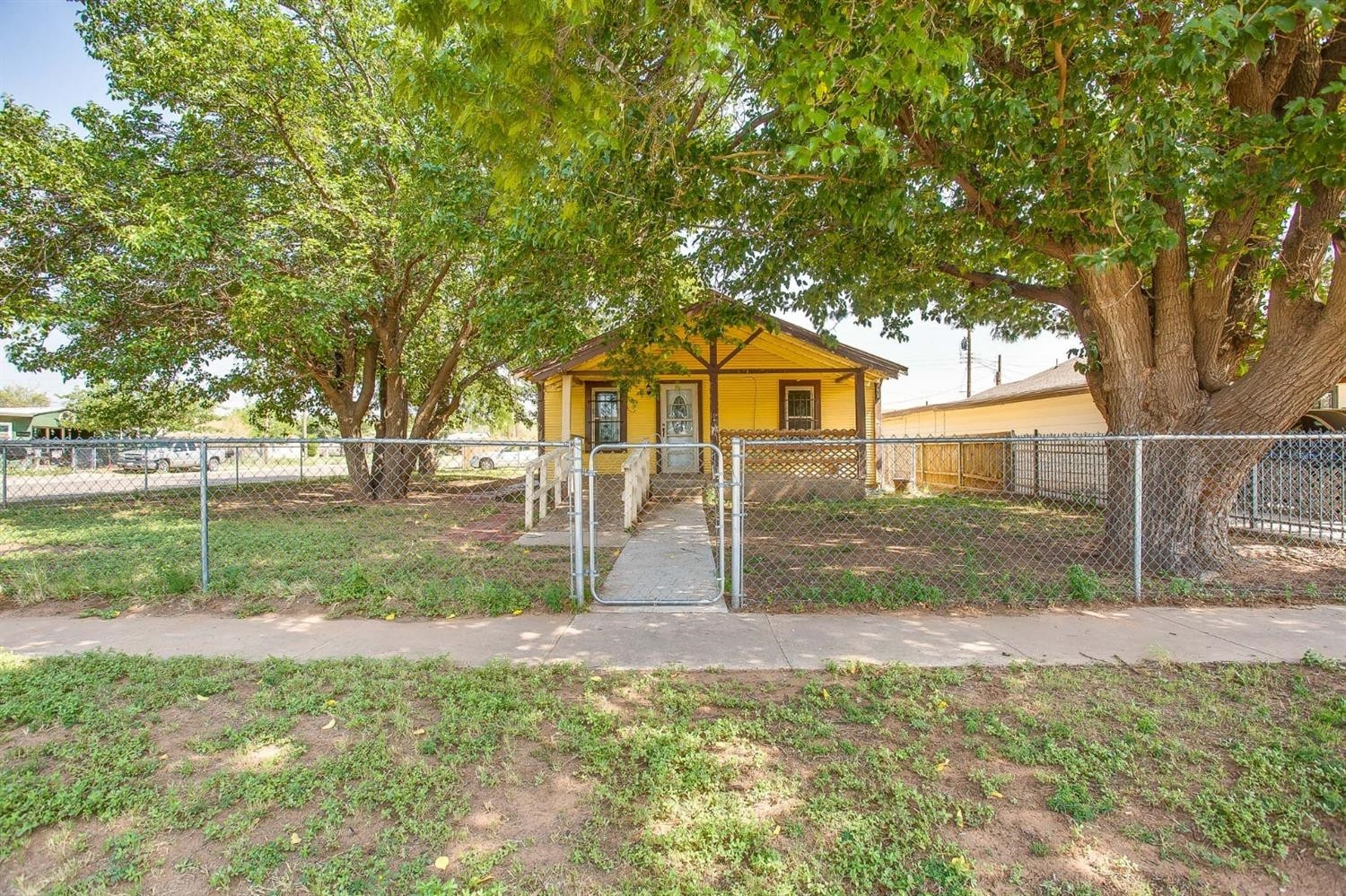 3114 Bates Street Lubbock, TX 79415 - Photo 1 of 15 Exterior with large trees.
