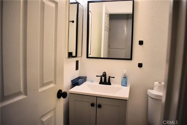 a bathroom with a sink and mirror