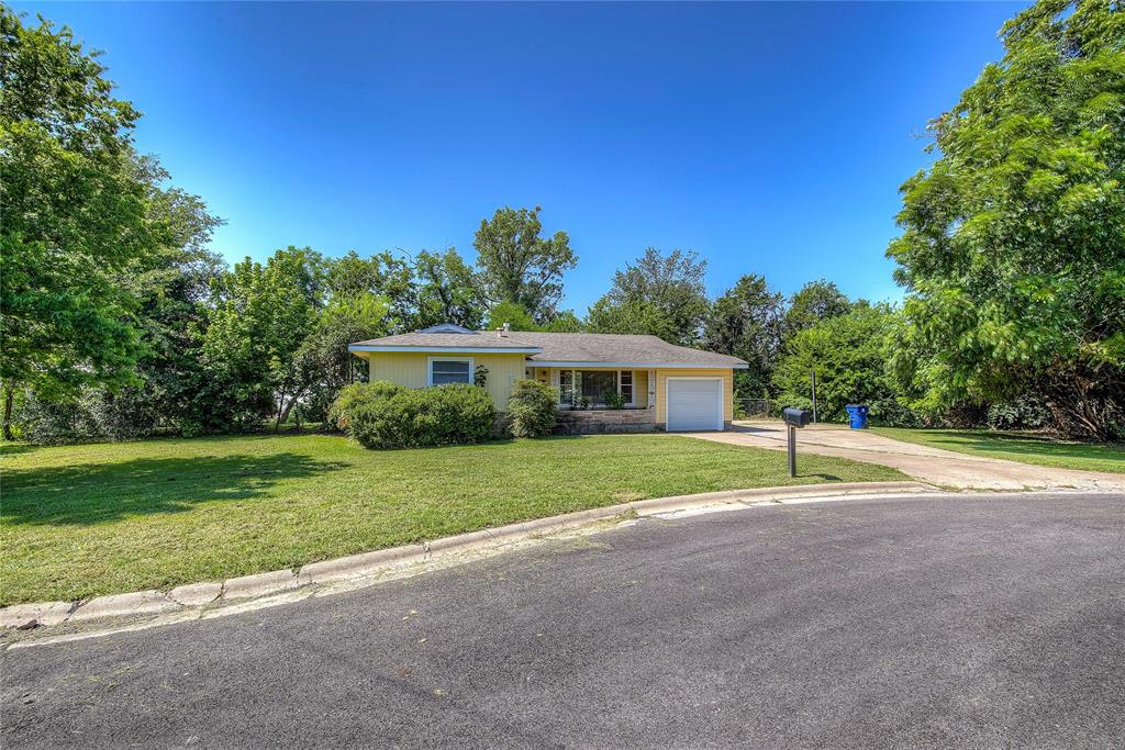 115 Ellis Circle Greenville, TX 75401 - Photo 1 of 1 a yellow and red house with a big yard
