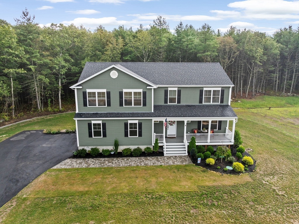 8 Big River Road Coventry, RI 02816 - Photo 2 of 42 a front view of a house with a yard table and chairs