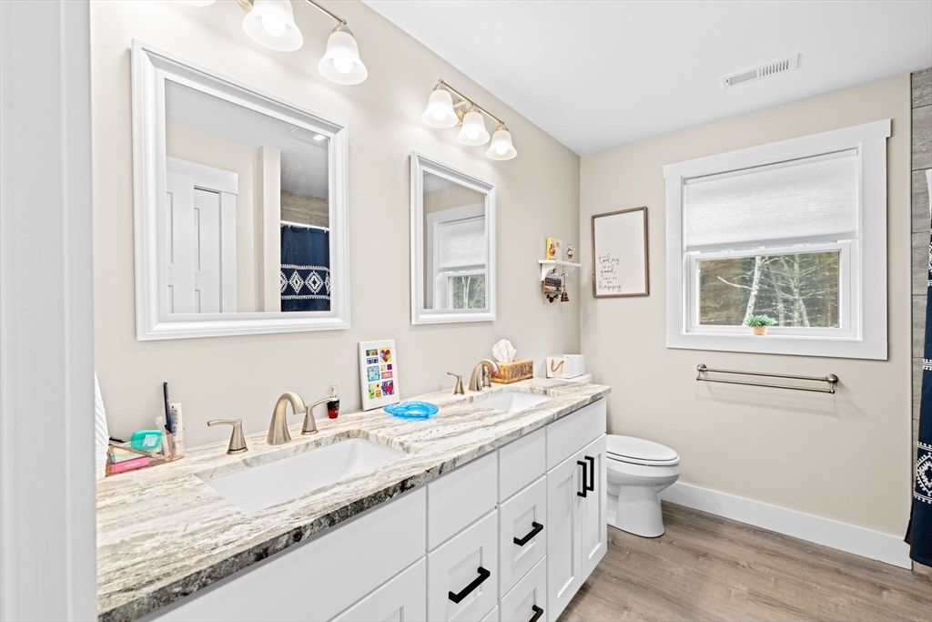 8 Big River Road Coventry, RI 02816 - Photo 21 of 42 a bathroom with a granite countertop sink mirror and a