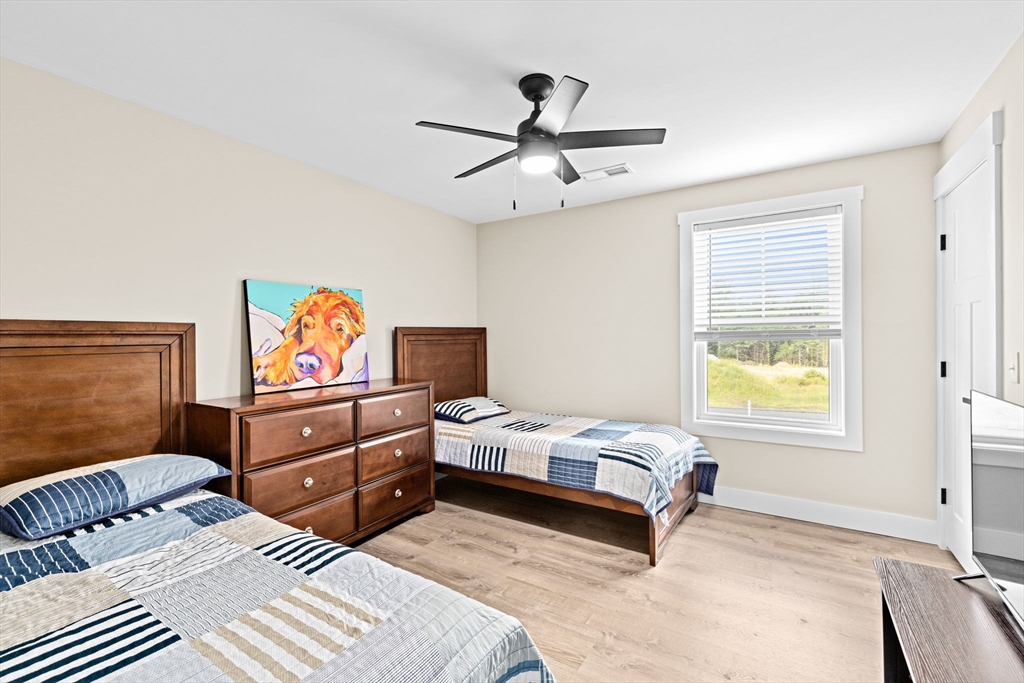 8 Big River Road Coventry, RI 02816 - Photo 22 of 42 a bedroom with a bed and a tv on the dresser