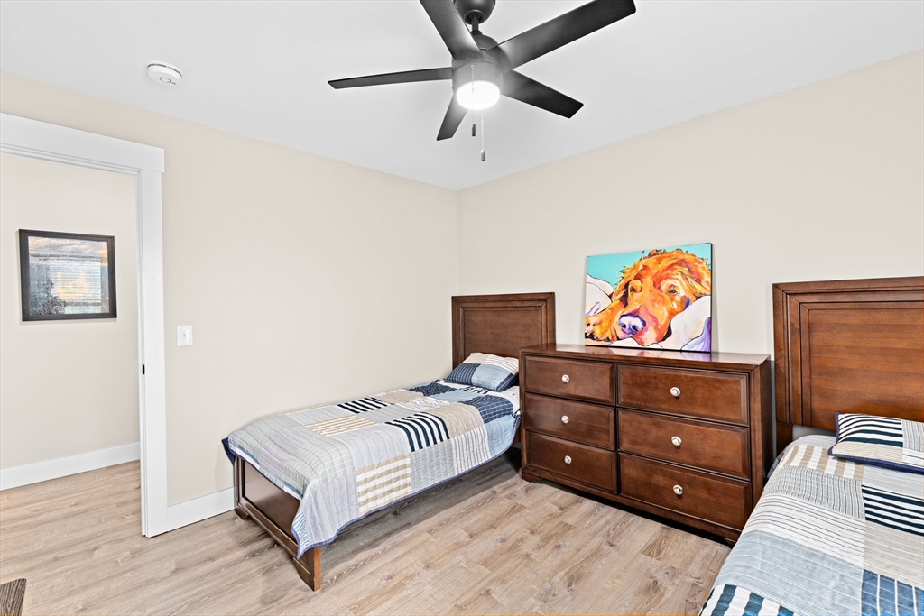 8 Big River Road Coventry, RI 02816 - Photo 23 of 42 a bedroom with a bed and wooden floor