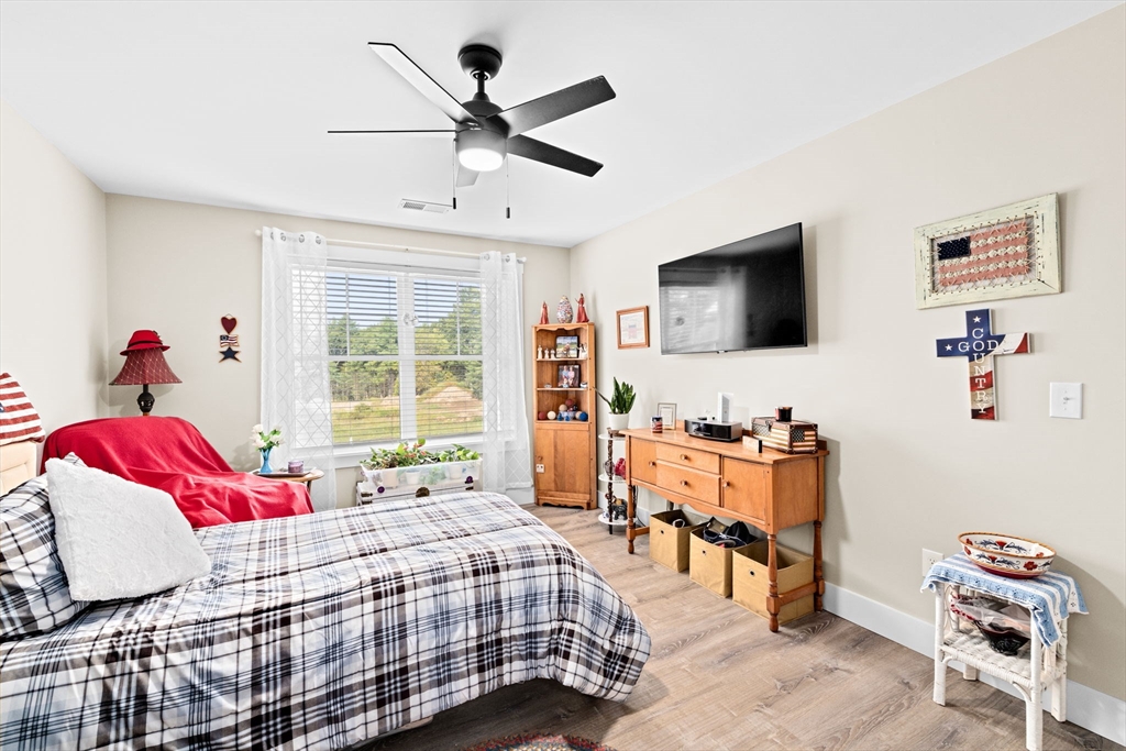 8 Big River Road Coventry, RI 02816 - Photo 27 of 42 a bedroom with a bed and a flat screen tv