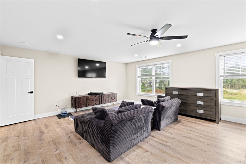 8 Big River Road Coventry, RI 02816 - Photo 30 of 42 a living room with furniture and a flat screen tv