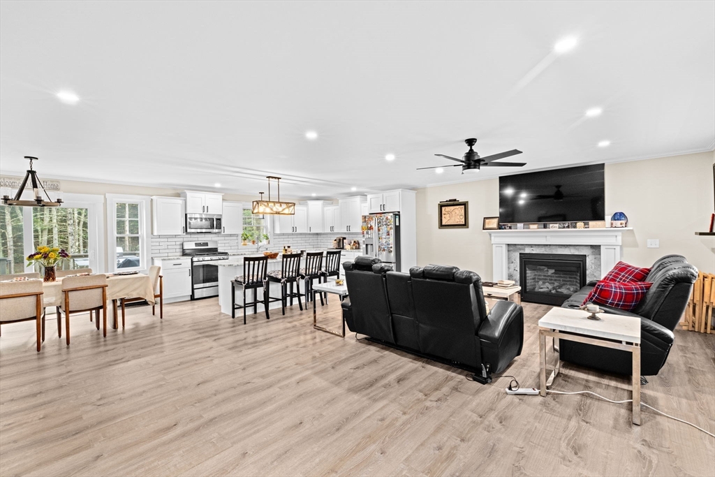 8 Big River Road Coventry, RI 02816 - Photo 3 of 42 a living room with furniture fireplace and flat screen tv
