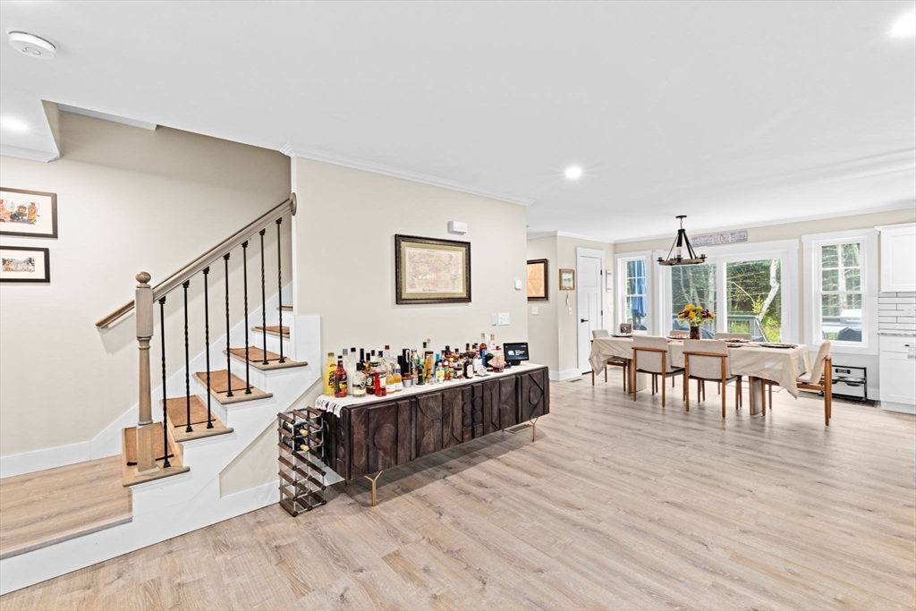 8 Big River Road Coventry, RI 02816 - Photo 5 of 42 a living room with furniture and a dining table with wooden floor